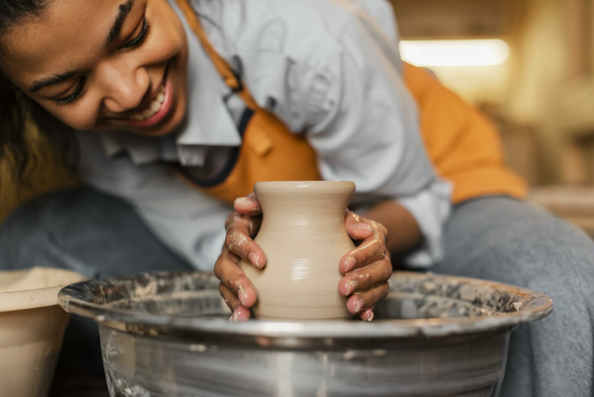 close-up-woman-doing-pottery-scaled